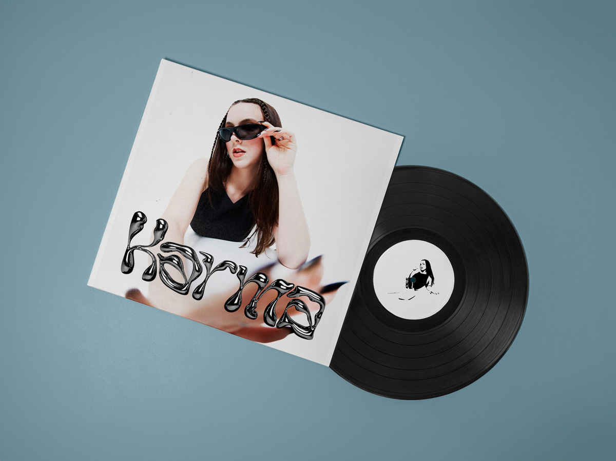 A vinyl record with a girl wearing sunglasses on the cover. 